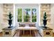 Cozy sitting area with built-in shelves, a bench seat, and large windows overlooking a garden at 3382 Habersham Rd, Atlanta, GA 30305