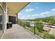 Outdoor balcony area featuring a grill and bicycle with a lovely view of mature trees at 3400 Malone Dr # 303, Atlanta, GA 30341