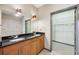 Bathroom with a double sink vanity, modern fixtures, and a walk-in closet at 3400 Malone Dr # 303, Atlanta, GA 30341