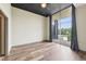Bedroom featuring hardwood floors and large windows with views of the outdoors at 3400 Malone Dr # 303, Atlanta, GA 30341