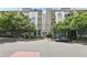 Modern condo building exterior with trees, street view, and covered parking at 3400 Malone Dr # 303, Atlanta, GA 30341