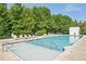 Community pool with lounge chairs surrounding the pool deck, perfect for relaxation at 3400 Malone Dr # 303, Atlanta, GA 30341