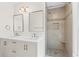 Beautiful bathroom featuring double sinks, large mirrors, and a tiled shower at 4108 Gray Birch Ln, Duluth, GA 30096