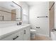 Bright bathroom with a white vanity, black hardware, and tiled shower/tub at 4108 Gray Birch Ln, Duluth, GA 30096
