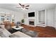 Living room featuring a fireplace, hardwood floors, and neutral décor at 4108 Gray Birch Ln, Duluth, GA 30096