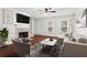 Bright living room with fireplace, hardwood floors, and neutral furnishings at 4108 Gray Birch Ln, Duluth, GA 30096