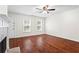Bright, sunlit living room featuring hardwood floors and neutral colors at 4108 Gray Birch Ln, Duluth, GA 30096