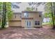Large backyard with a patio and mature trees and minimal grass at 7113 Ambercrest Ct, Austell, GA 30168