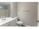 Well-lit bathroom features a neutral color scheme and a white vanity at 7113 Ambercrest Ct, Austell, GA 30168