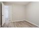 Cozy bedroom featuring hardwood floors and fresh neutral paint at 7113 Ambercrest Ct, Austell, GA 30168