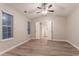 Bright bedroom featuring vaulted ceilings, wood-look floors, and an ensuite bathroom at 7113 Ambercrest Ct, Austell, GA 30168