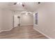 Bright bedroom featuring vaulted ceilings, wood-look floors, and an ensuite bathroom at 7113 Ambercrest Ct, Austell, GA 30168