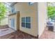 Rear exterior featuring a back patio, a well maintained yard and a HVAC unit at 7113 Ambercrest Ct, Austell, GA 30168