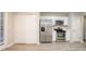 Well-lit kitchen equipped with stainless steel appliances, white cabinets, and durable light gray flooring at 7113 Ambercrest Ct, Austell, GA 30168