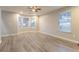 Bright living room featuring recessed lighting, light gray flooring, and a bay window that lets in plenty of light at 7113 Ambercrest Ct, Austell, GA 30168
