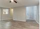 Open-concept living room with light gray flooring and easy access to the staircase at 7113 Ambercrest Ct, Austell, GA 30168