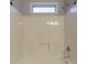Bright bathroom features a shower-tub combination and neutral wall color at 7113 Ambercrest Ct, Austell, GA 30168