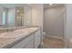 Bathroom featuring double sinks, granite countertop, and a separate shower at 16 Deer Place, Villa Rica, GA 30180