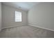 Bright bedroom features a window and neutral carpeting at 16 Deer Place, Villa Rica, GA 30180