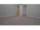 Spacious bedroom with neutral carpet, closet, and an adjoining bathroom at 16 Deer Place, Villa Rica, GA 30180