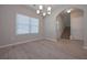 Charming dining room features wood floors, a chandelier, and lots of natural light at 16 Deer Place, Villa Rica, GA 30180