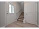 Welcoming entryway with wood floors, stairway, and natural light at 16 Deer Place, Villa Rica, GA 30180