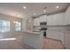 Well-lit kitchen featuring a center island, stainless steel appliances, and wood floors at 16 Deer Place, Villa Rica, GA 30180