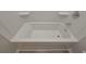 Clean bathtub and shower combo with built-in shelving at 16 Deer Place, Villa Rica, GA 30180