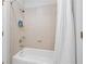 Bathroom with tiled walls, a shower head, and a bathtub with a shower curtain at 1974 Mason Mill Rd, Decatur, GA 30033