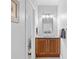 Bathroom with wood cabinets, a framed mirror, and a sink at 1974 Mason Mill Rd, Decatur, GA 30033
