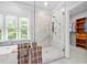 Bathroom features a glass shower and a large window over the soaking tub at 1974 Mason Mill Rd, Decatur, GA 30033