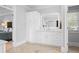 Bathroom with a white vanity with drawers and an illuminated mirror at 1974 Mason Mill Rd, Decatur, GA 30033