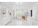 Bright bathroom with double vanity, large soaking tub, and walk-in shower at 1974 Mason Mill Rd, Decatur, GA 30033