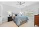 Bedroom featuring a ceiling fan, carpet flooring, and a window at 1974 Mason Mill Rd, Decatur, GA 30033