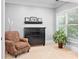 Cozy bedroom with a chair, dresser, shelf, and large window with blinds at 1974 Mason Mill Rd, Decatur, GA 30033