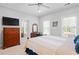 Bedroom with a ceiling fan, carpet, and a view to the bathroom at 1974 Mason Mill Rd, Decatur, GA 30033