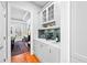 Convenient butler's pantry with white cabinetry, wine storage, and easy access to the dining area at 1974 Mason Mill Rd, Decatur, GA 30033