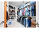 A walk-in closet with shelving and hanging rods for clothing and shoes at 1974 Mason Mill Rd, Decatur, GA 30033