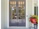 Elegant double front doors with glass panes, accented by a decorative potted plant at 1974 Mason Mill Rd, Decatur, GA 30033