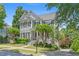 Attractive two-story home with meticulously landscaped yard and charming front porch at 1974 Mason Mill Rd, Decatur, GA 30033
