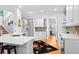 Bright kitchen with white cabinetry, granite countertops, stainless steel appliances, and breakfast bar at 1974 Mason Mill Rd, Decatur, GA 30033