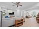 Comfortable living room featuring a modern ceiling fan, sleek television, and stylish decor at 1974 Mason Mill Rd, Decatur, GA 30033