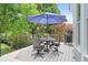Outdoor patio with patio furniture, perfect for relaxing and entertaining while enjoying the surrounding greenery at 1974 Mason Mill Rd, Decatur, GA 30033