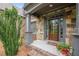 Close-up of a stone front porch with beautiful front door at 6345 Sterling Shores Dr, Cumming, GA 30041