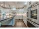 Gourmet kitchen with stainless appliances, farmhouse sink and hardwood floors at 6345 Sterling Shores Dr, Cumming, GA 30041