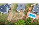Aerial showcases luxury homes, some with pools, in a verdant landscape; staged version available at 6830 Heard Ln, Cumming, GA 30041