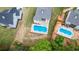 Aerial showcases luxury homes, some with pools, in a verdant landscape; staged version available at 6830 Heard Ln, Cumming, GA 30041