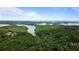 Stunning aerial view of waterfront property featuring lush forests and expansive lake views at 6830 Heard Ln, Cumming, GA 30041