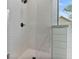 Walk-in shower with subway tile surround and seamless glass door at 6830 Heard Ln, Cumming, GA 30041