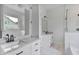Bright bathroom with dual sinks, granite countertops, and tiled floor at 6830 Heard Ln, Cumming, GA 30041